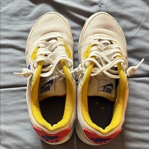 Nike Kids White and Yellow Sneakers with Red Accents